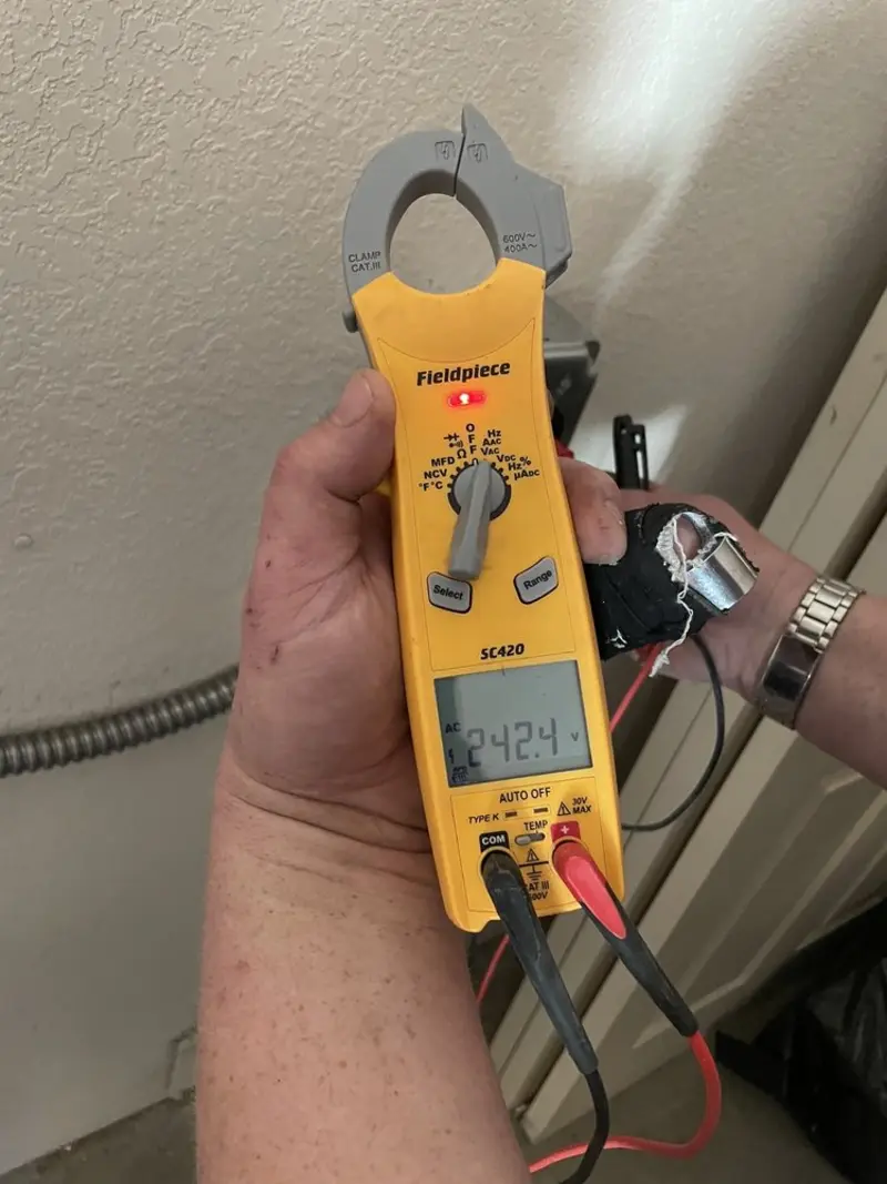Voltage testing with clamp meter during Whole House Surge Protector in Sullivan